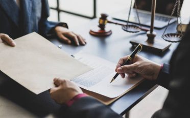 Lawyers negotiate agreements and sign contracts.